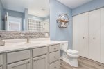 Convenient laundry room entry is perfect for dropping your towels after a day at the beach